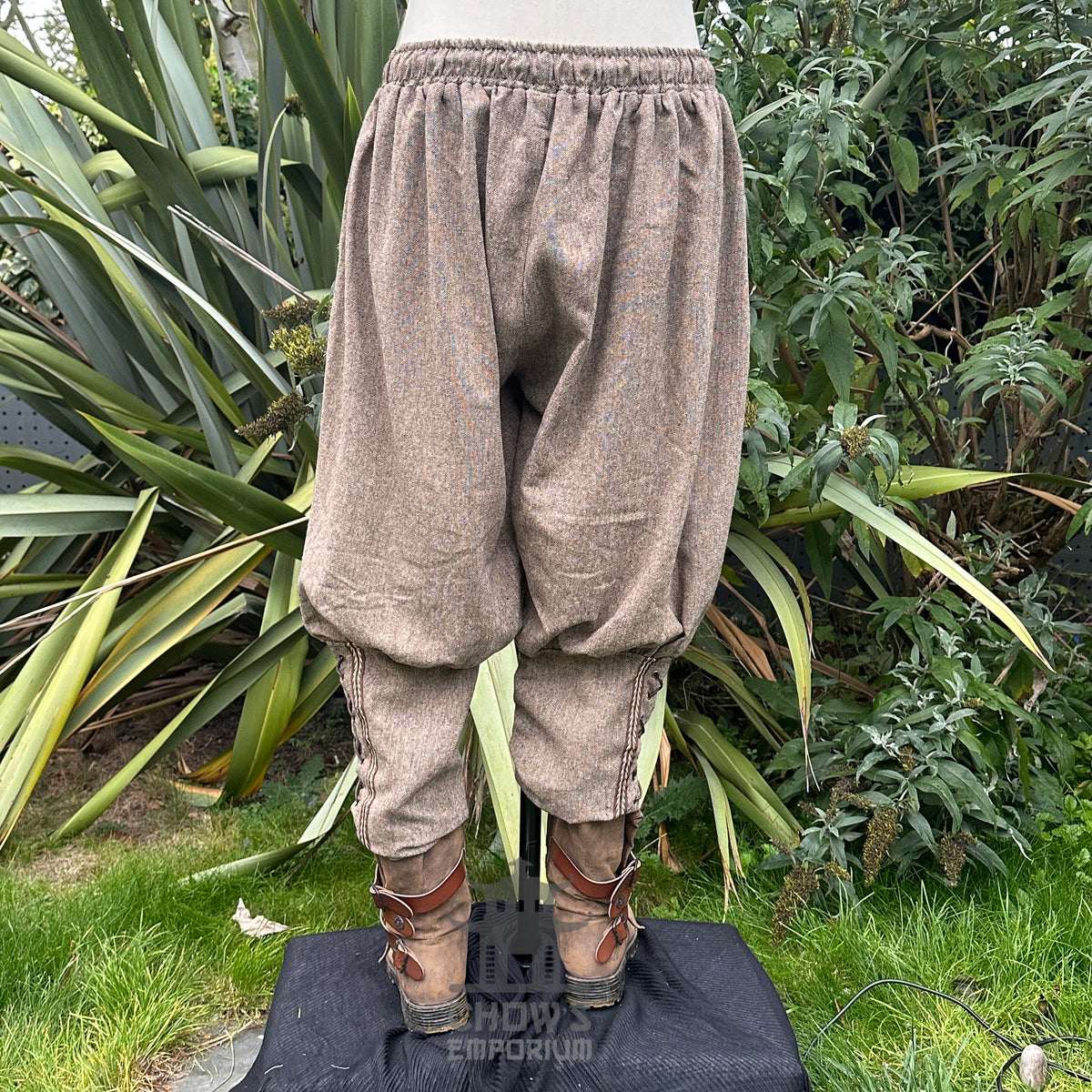 Brown wool Viking trousers with braided trim back.