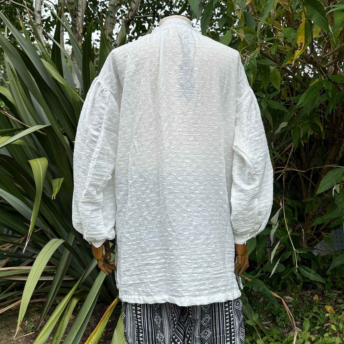 Textured white cotton and linen medieval shirt for LARP, back view.