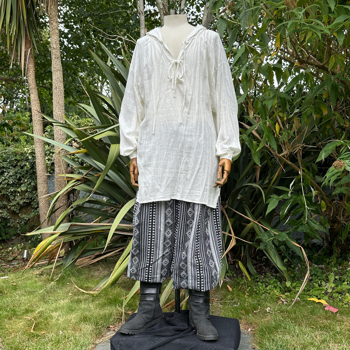 White hooded medieval LARP shirt on mannequin.