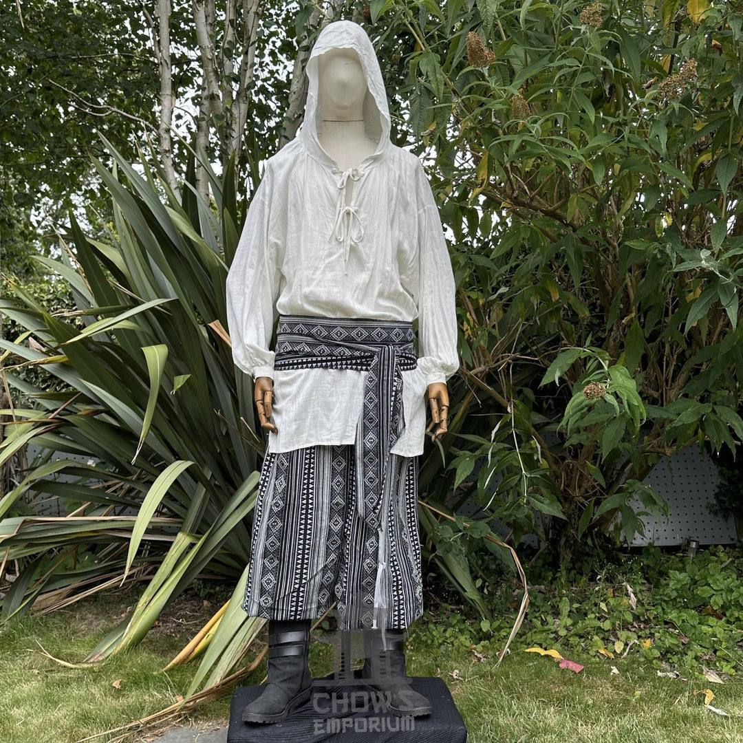 Medieval LARP outfit front view, featuring a white hooded shirt, black and white trousers and sash. For Renaissance Faire and historical roleplay events.