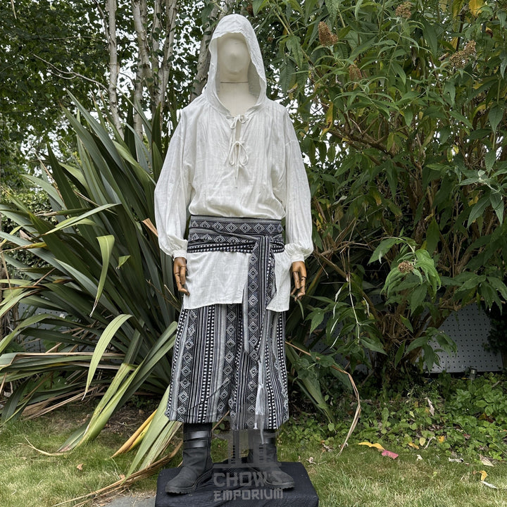 Medieval LARP outfit front view, featuring a white hooded shirt, black and white trousers and sash. For Renaissance Faire and historical roleplay events.