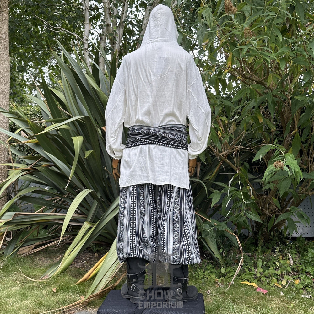Medieval LARP outfit back view, featuring a white hooded shirt, black and white trousers and sash. For Renaissance Faire and historical roleplay events.