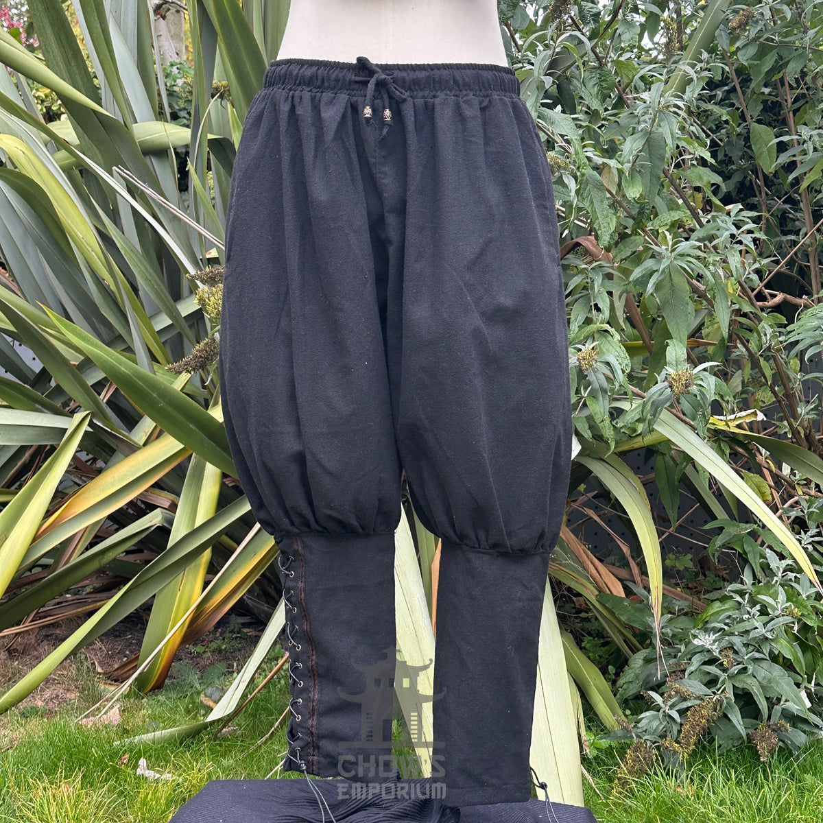 handmade wool viking trousers with decorative braid.
