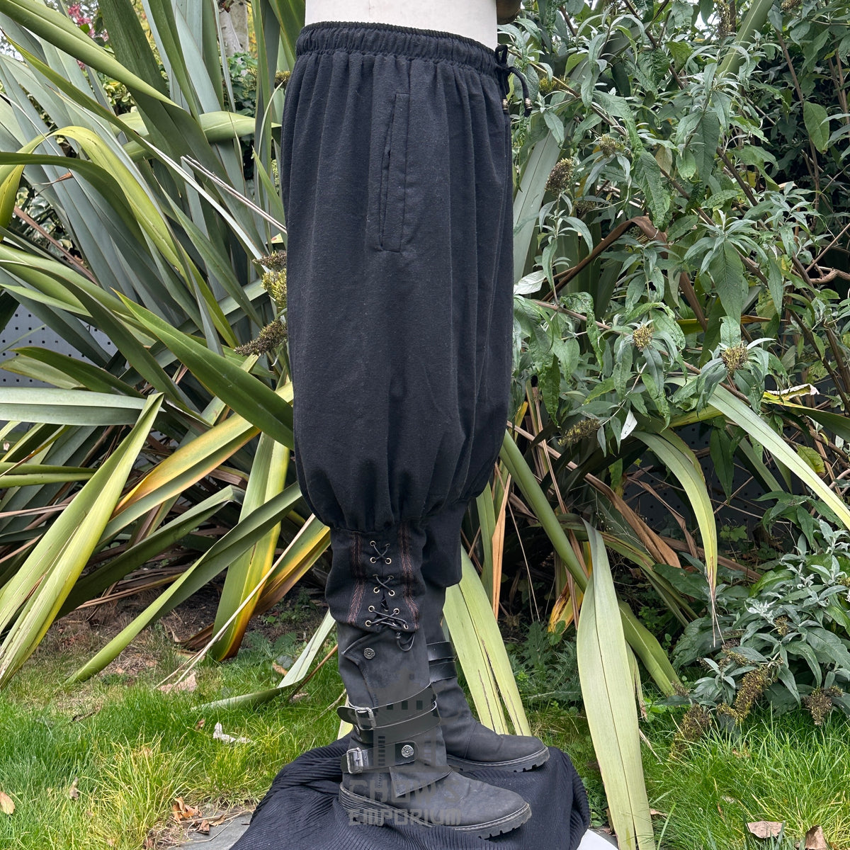 braiding medieval trousers in black wool.