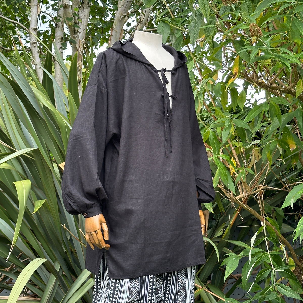 Black cotton and linen medieval hooded shirt for LARP on mannequin.