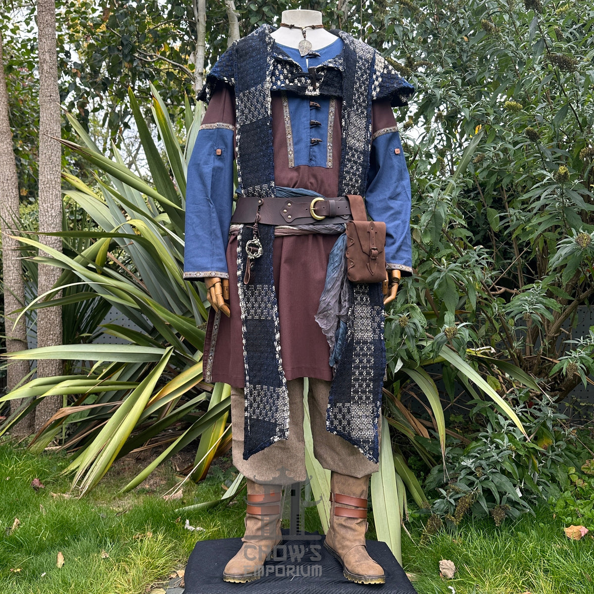 Blue and white check wool scarf hood on medieval LARP costume, front view.