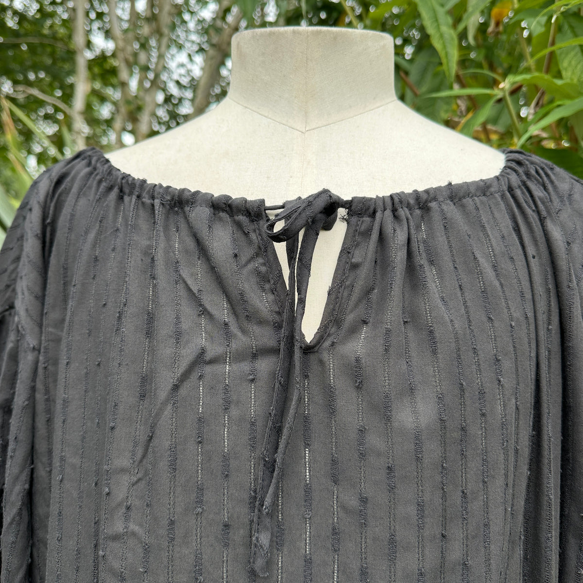 classic black round-neck medieval top for reenactment wear.