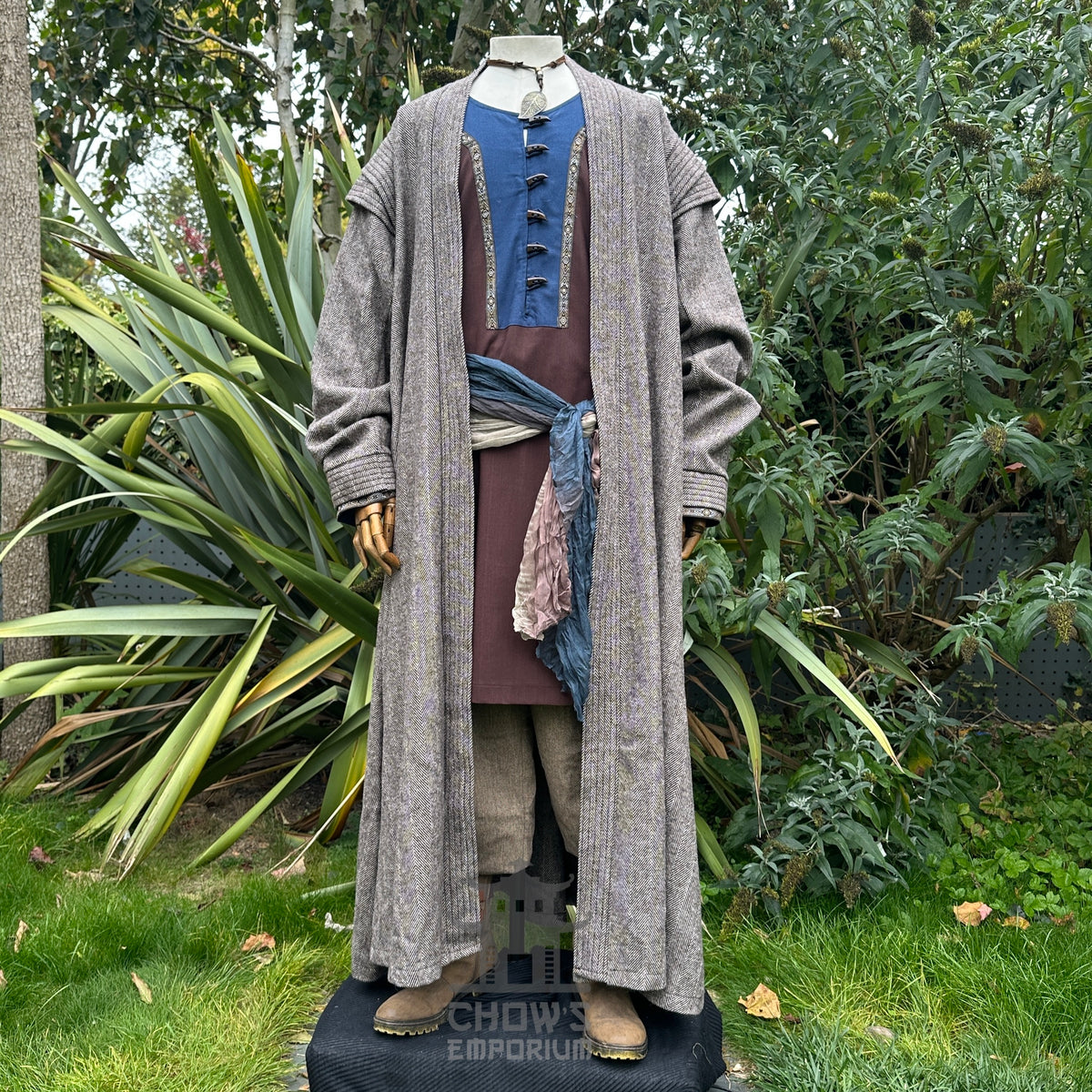 Grey robe, blue tunic, beige pants, and sash on mannequin for LARP.