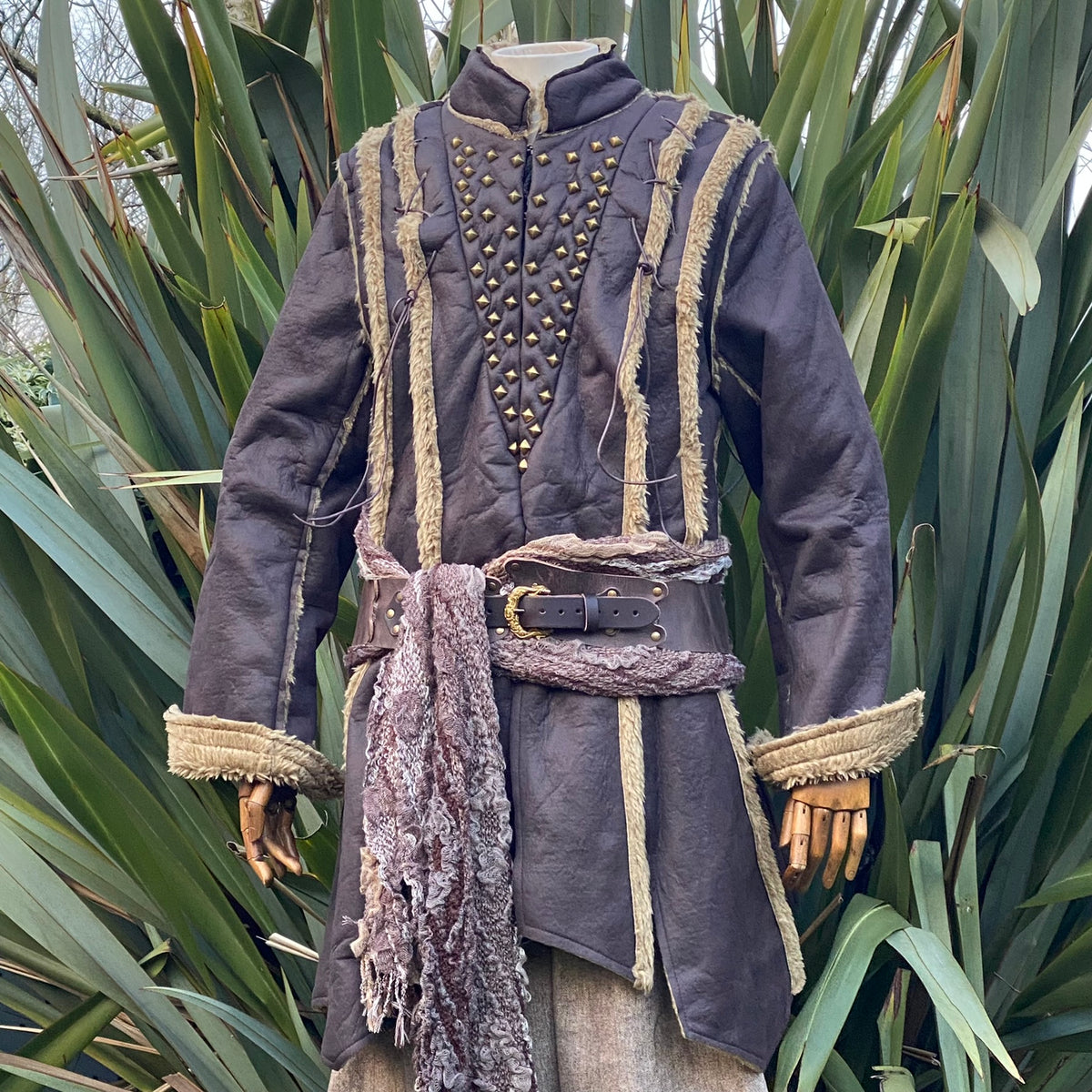 Dark brown medieval LARP jacket with textured fabric and decorative trim.