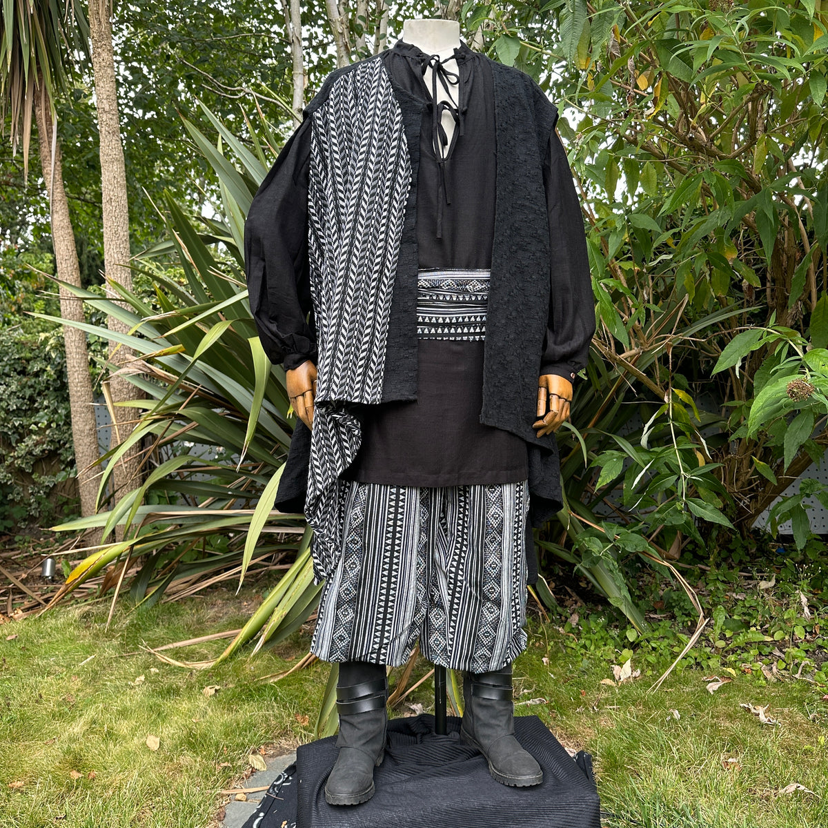 Matching black sash belt tied around pirate waistcoat – costume detail shot.