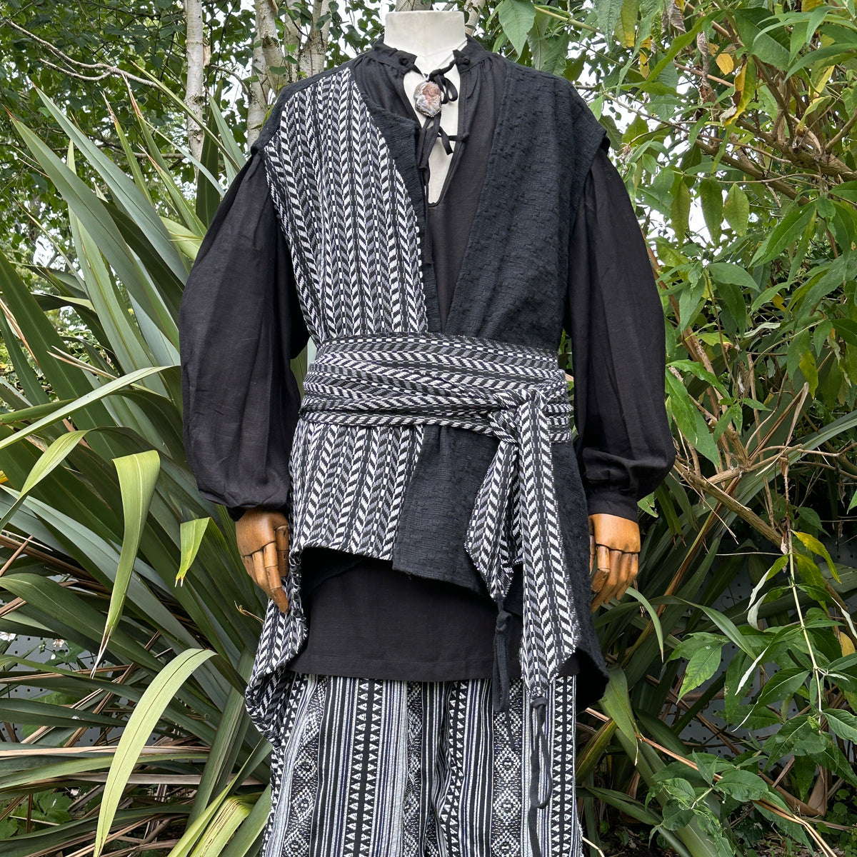 Pirate waistcoat and sash, side view with foliage for LARP.