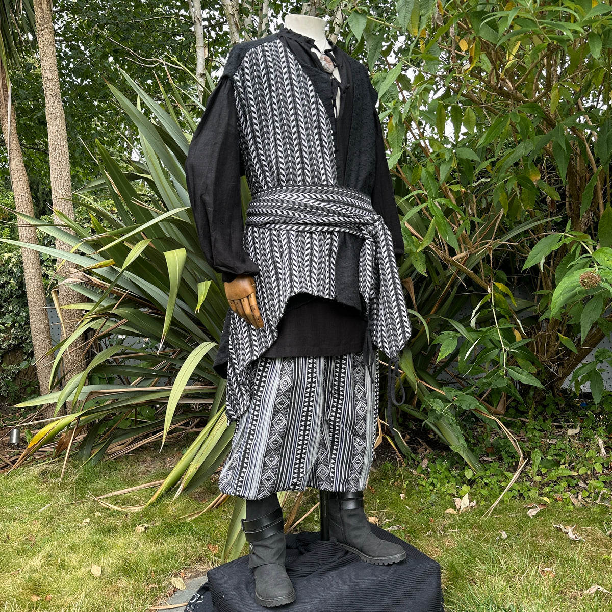 Asymmetrical front panel pirate waistcoat in black and white wool mix – side view.