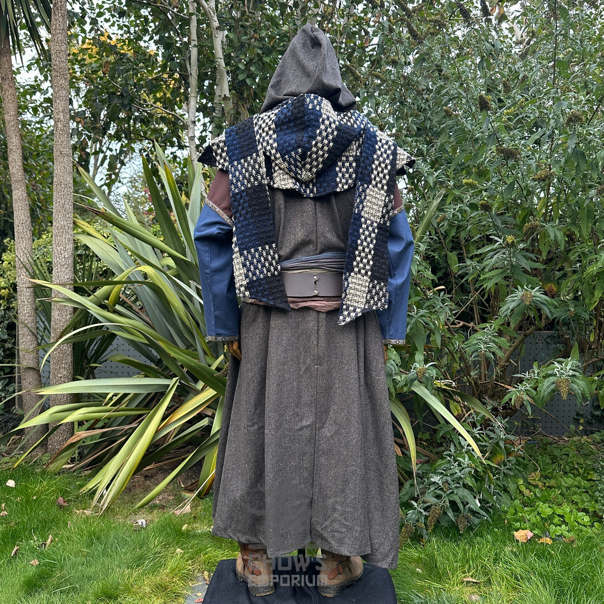 Medieval ranger LARP outfit with grey robe, hood, and checkered shoulder sash.
