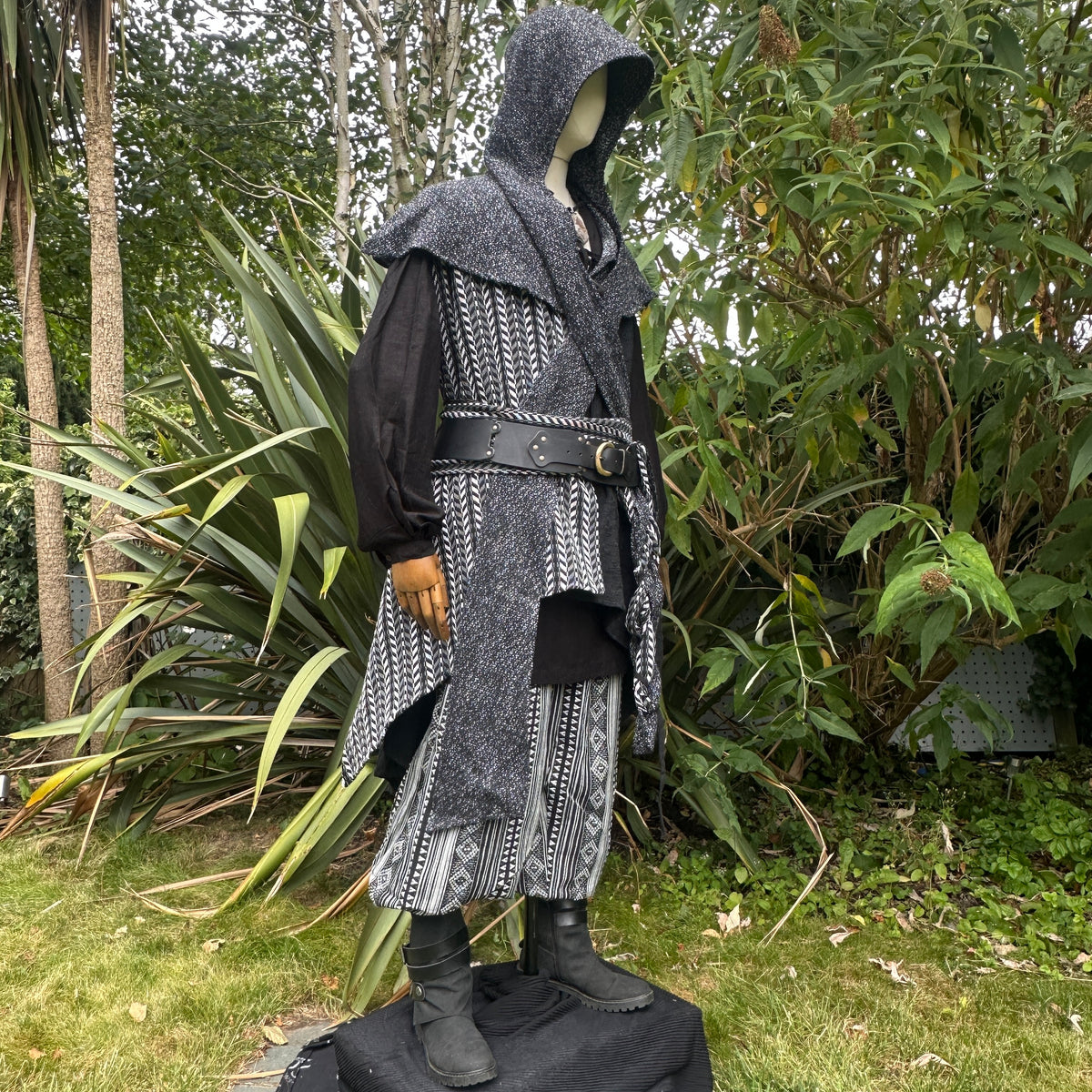 LARP ranger outfit side view, hood up, intricate black and grey patterns.