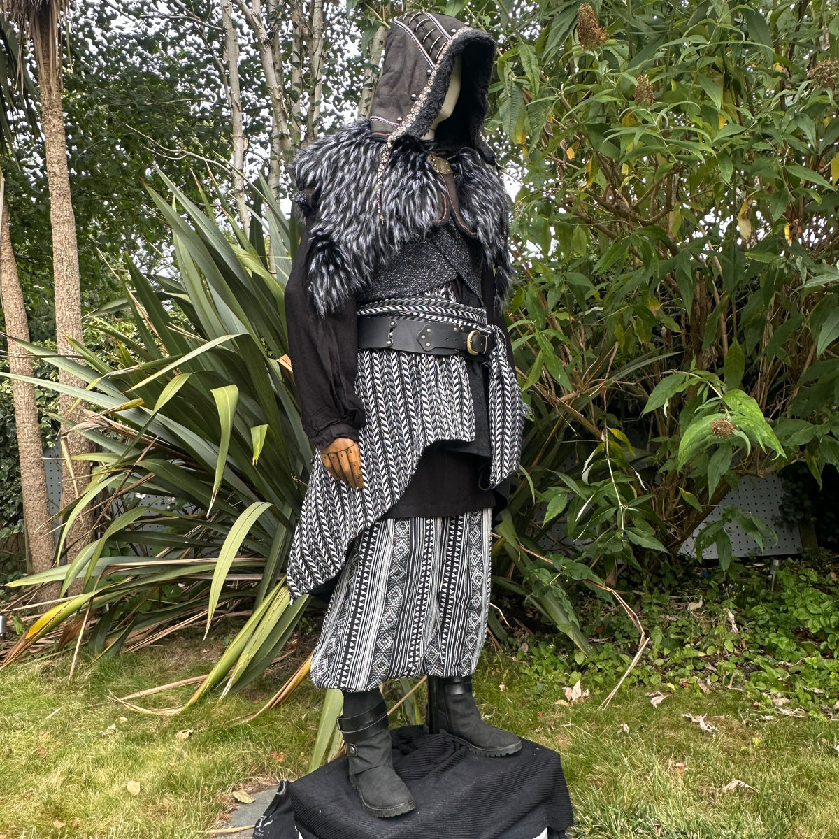 Stone Warrior LARP set with grey tunic and fur cloak, side view.
