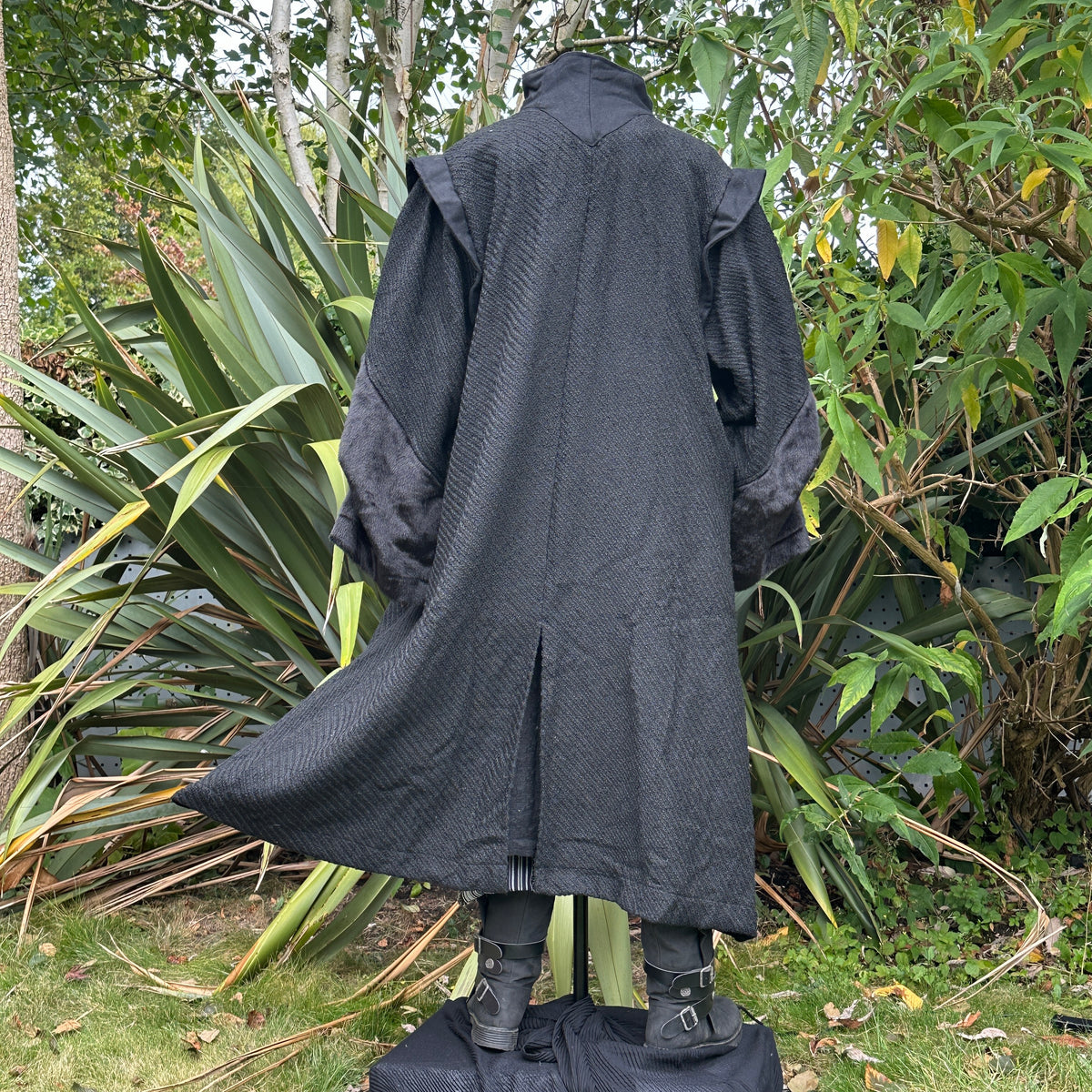 Back view of black medieval LARP robe with high collar.
