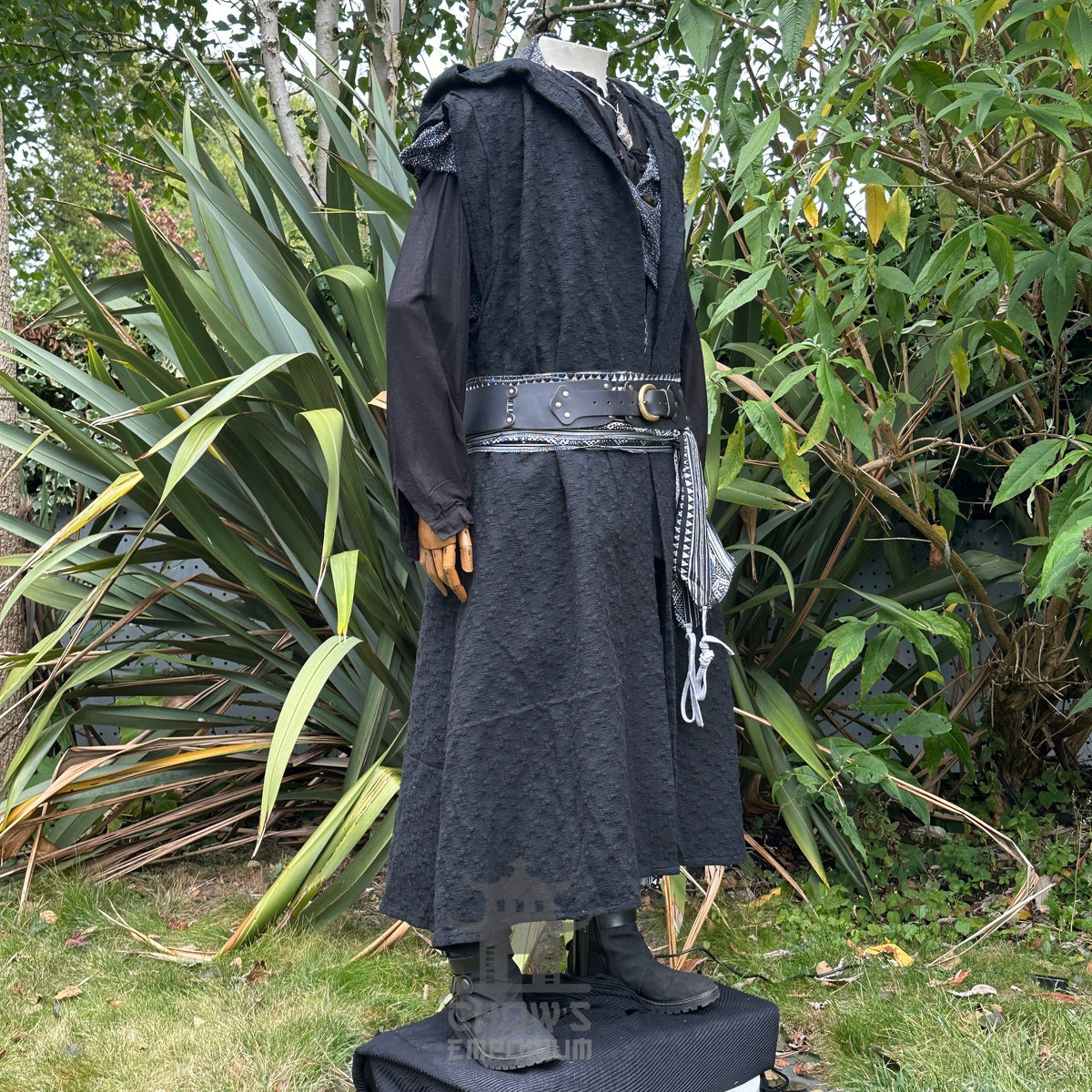 Black sleeveless LARP robe, textured fabric, side view, with belt and sash.