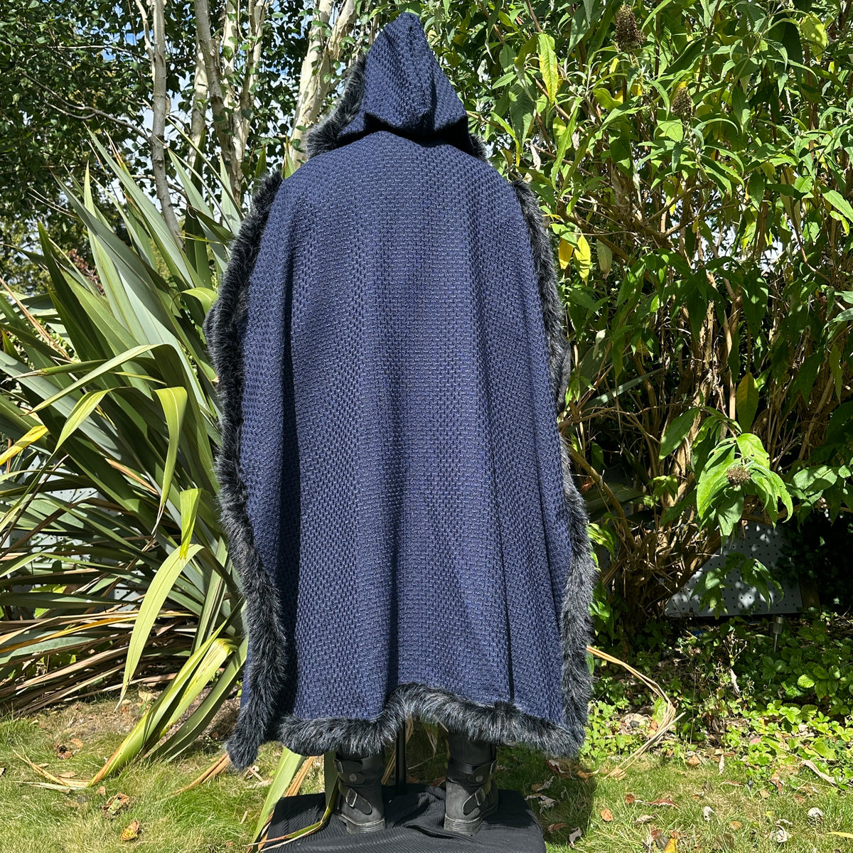Angled hooded view of blue and black fur-trimmed Viking LARP cape, medieval fantasy cosplay.