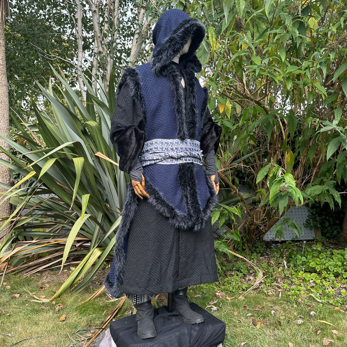 Angled front view of Viking-style blue and black LARP cape, medieval fantasy cosplay costume.
