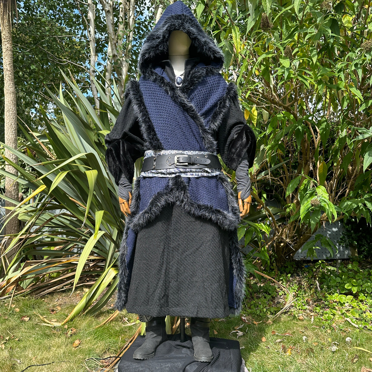 Front view of blue and black Viking LARP cape with faux fur trim, medieval fantasy cosplay.