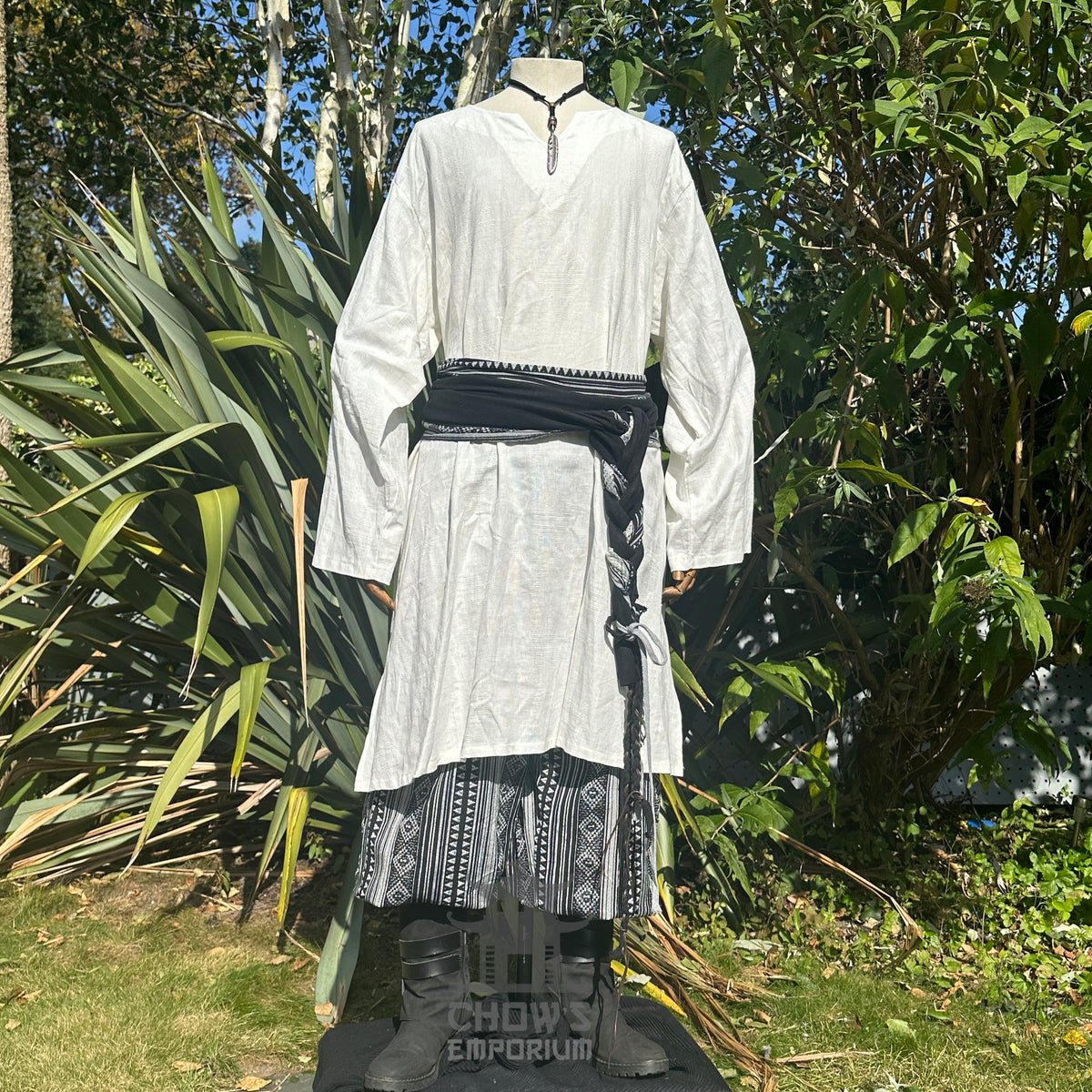 White tunic and trousers with black belt and sashes, LARP medieval style.