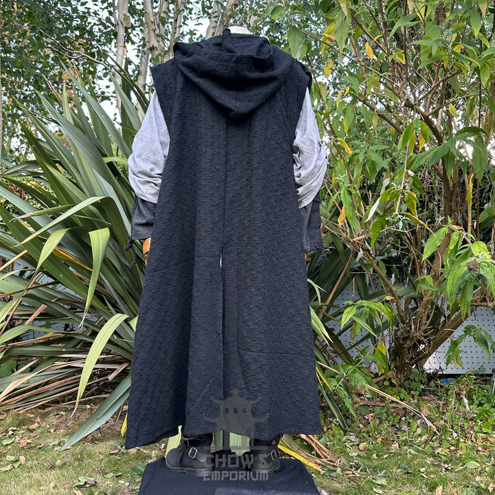 Medieval LARP outfit back view, featuring a black hooded robe, grey tunic, and sash. For Renaissance Faire and historical roleplay events.