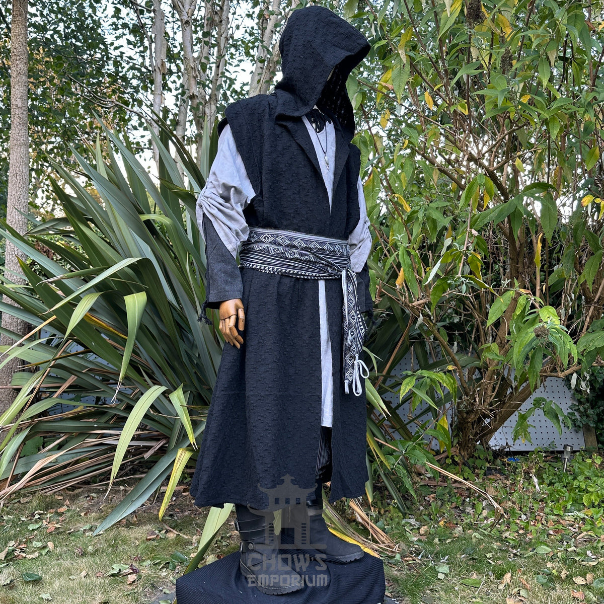 Viking LARP set: black hooded robe, grey tunic, patterned sash. Front view.