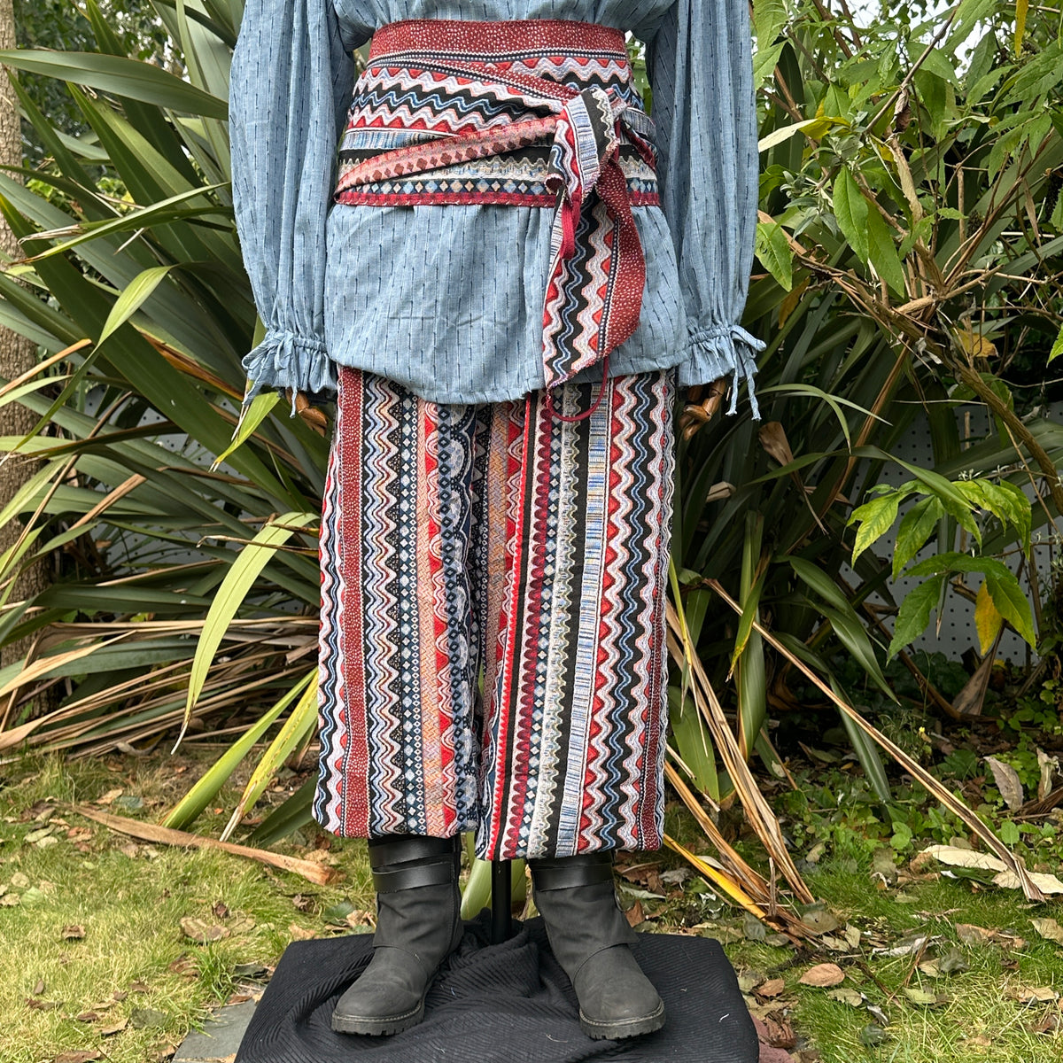Blue shirt with red sash and zigzag pants for LARP medieval costume.