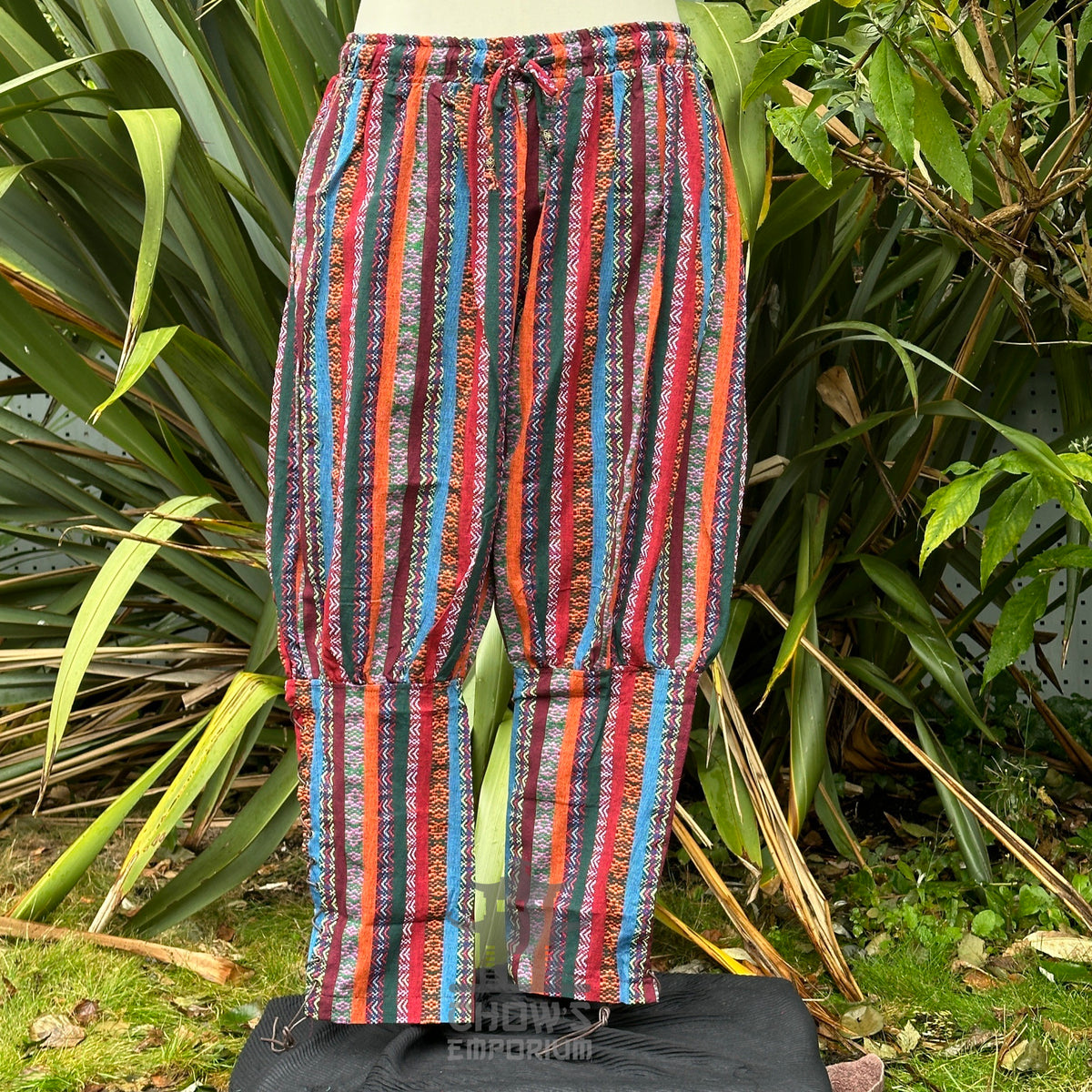Front view of multi-color Viking trousers with crossover lacing and relaxed fit no boots.