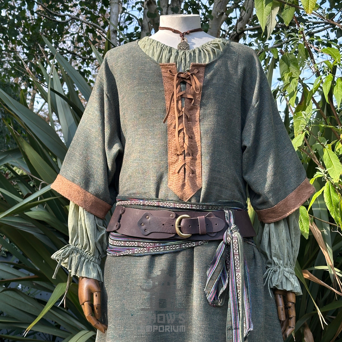 Green medieval tunic, striped sash, and shirt with brown details for LARP.