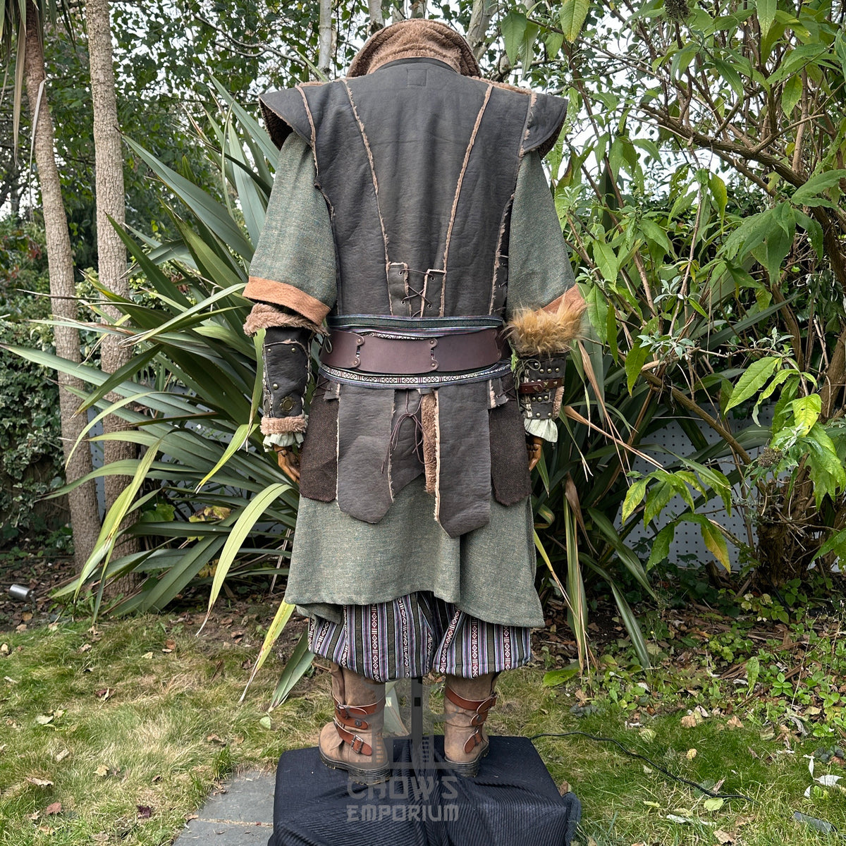 Back angle of green medieval LARP waistcoat with brown accents and belt.