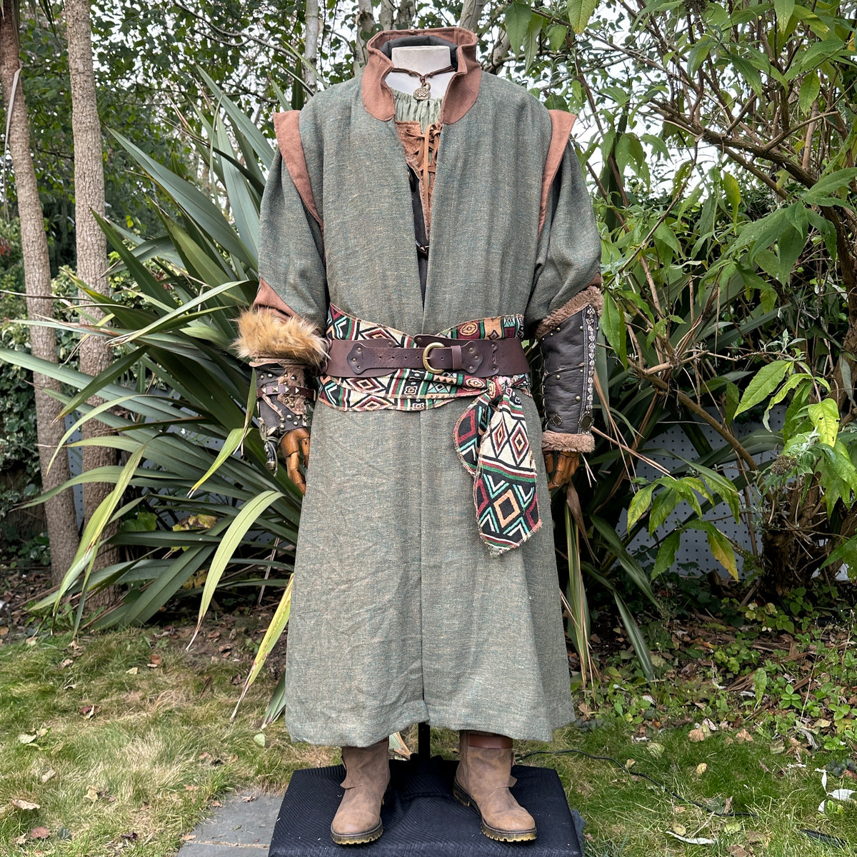 LARP forest guardian outfit with green robe, patterned belt, leather accents.