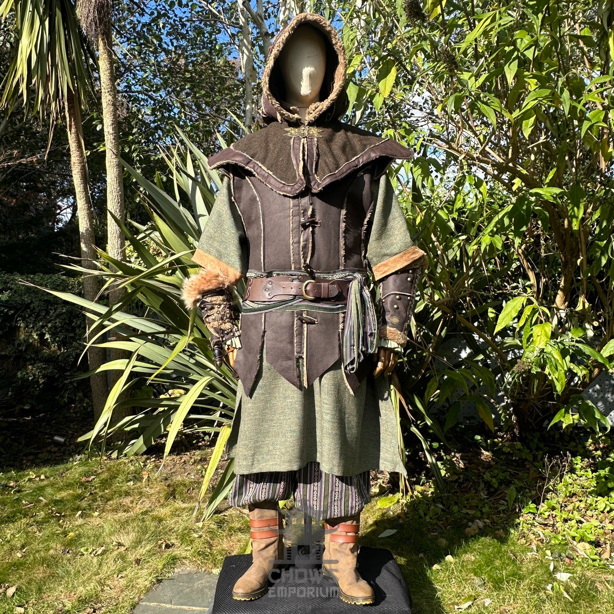 Medieval LARP costume front view, featuring brown leather waistcoat, hood and vambraces, a.