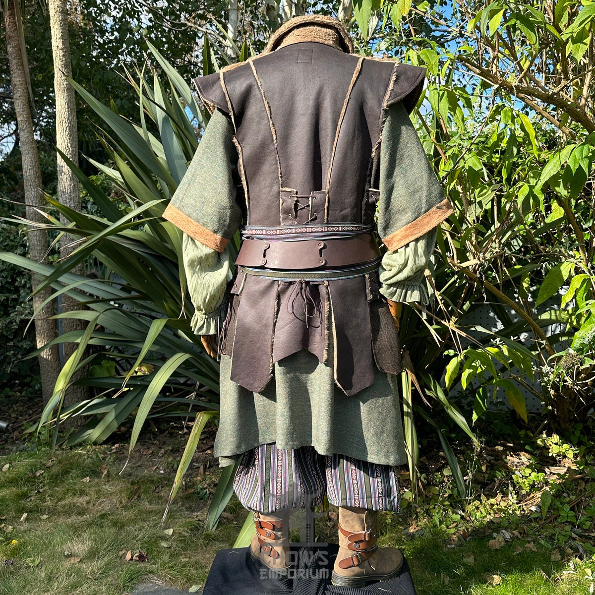 Medieval LARP costume back view, featuring a brown faux leather waistcoat, green woven tunic.
