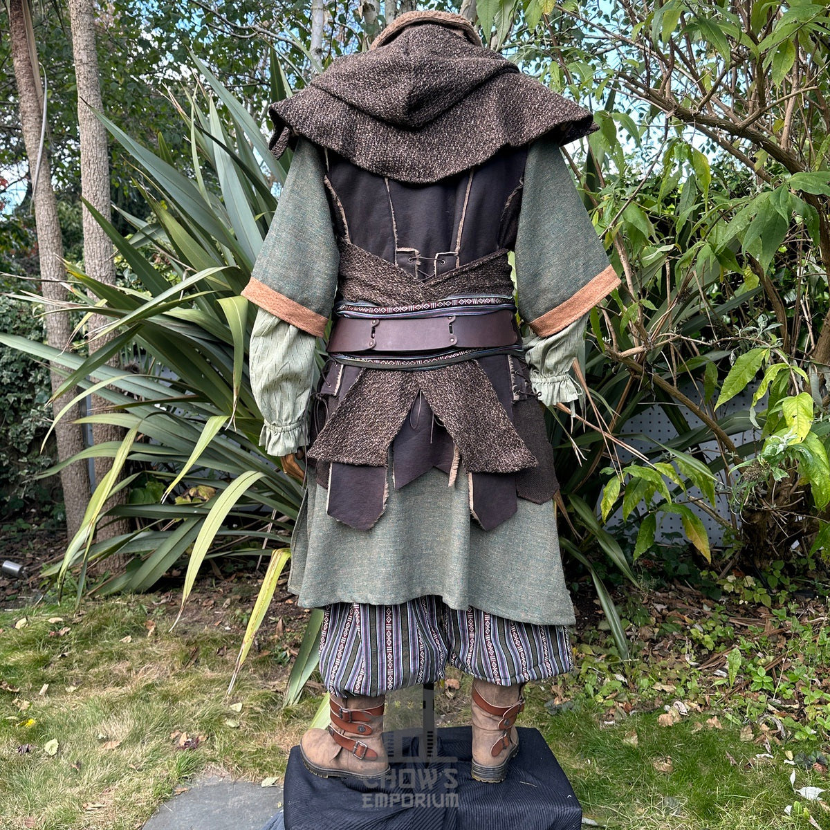 Medieval LARP costume back view, featuring a brown leather waistcoat, tunic, shirt, hood.