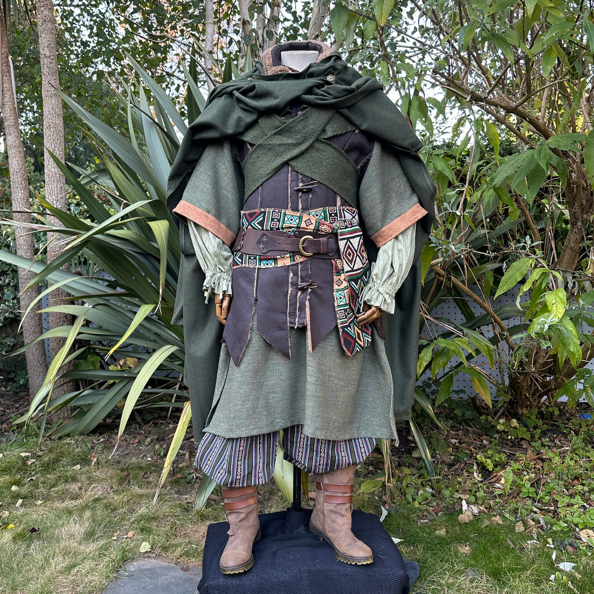Green medieval LARP robe, detailed belt, and cloak.