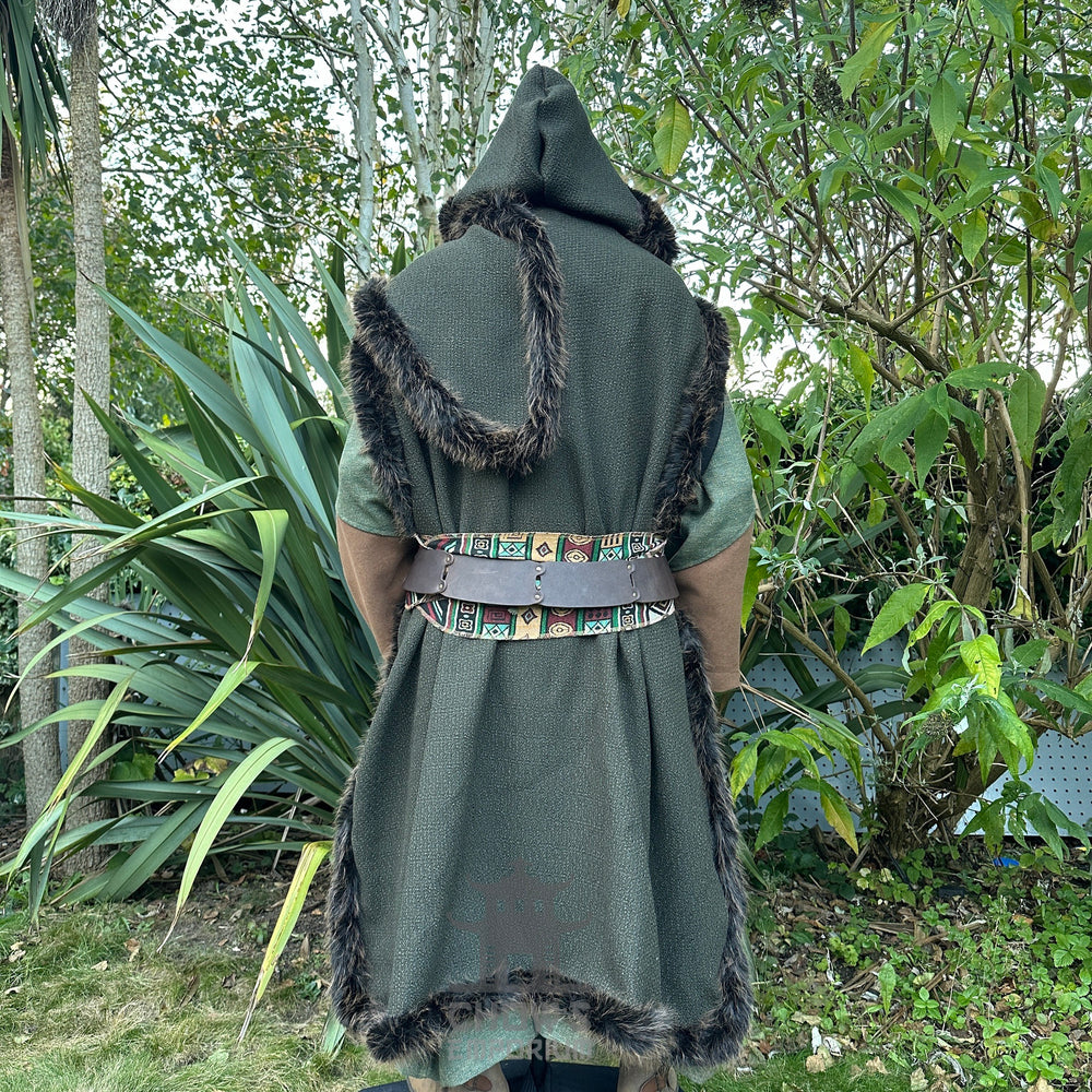Medieval LARP costume back view, featuring a green faux fur trim hooded cape, green high collared robe and sash. For Renaissance Faire and historical roleplay events.