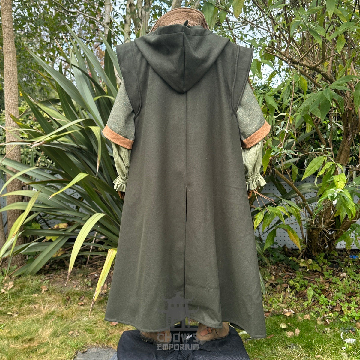 Dark green LARP robe with hood, back view amidst a.