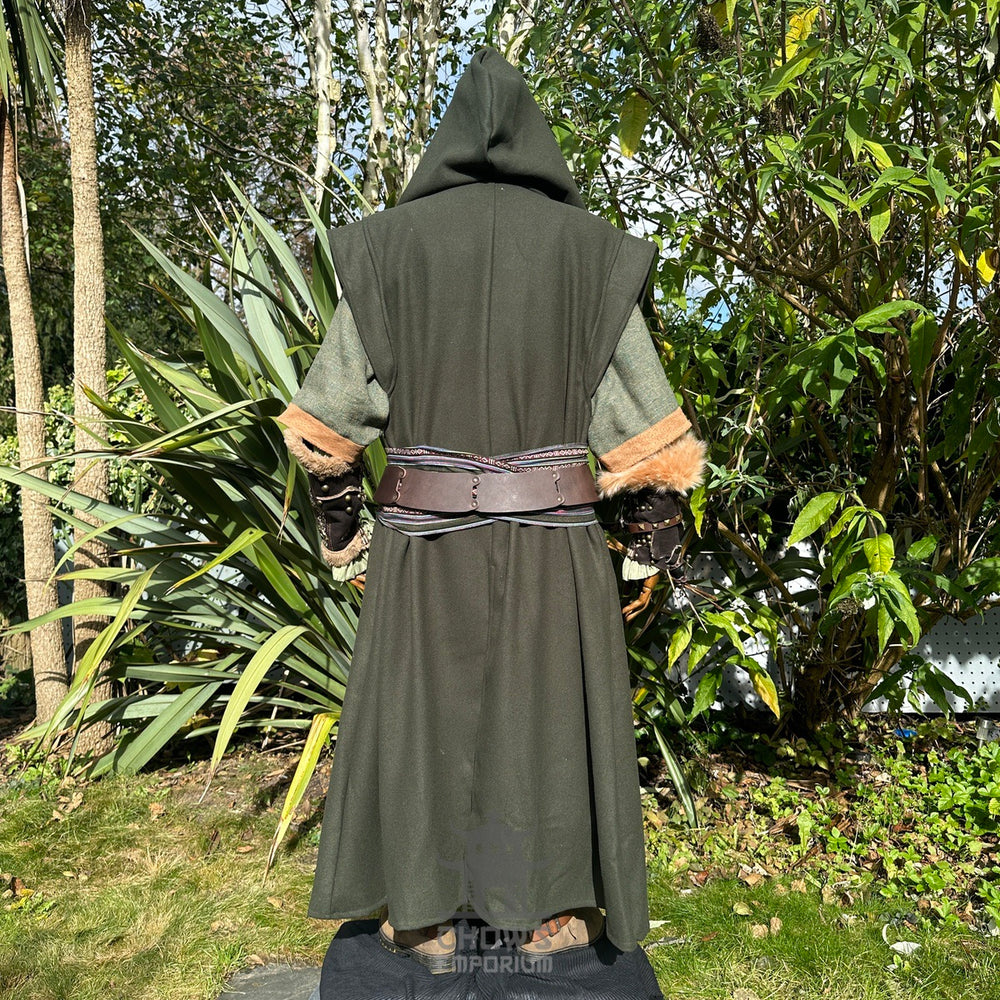 Medieval LARP outfit back view, featuring a green hooded robe, vambraces, belt, and sash. For Renaissance Faire and historical roleplay events.