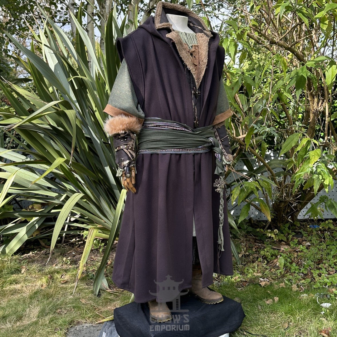 Medieval LARP outfit side view, featuring a brown hooded robe, vambraces, tunic, and sash. For Renaissance Faire and historical roleplay events.