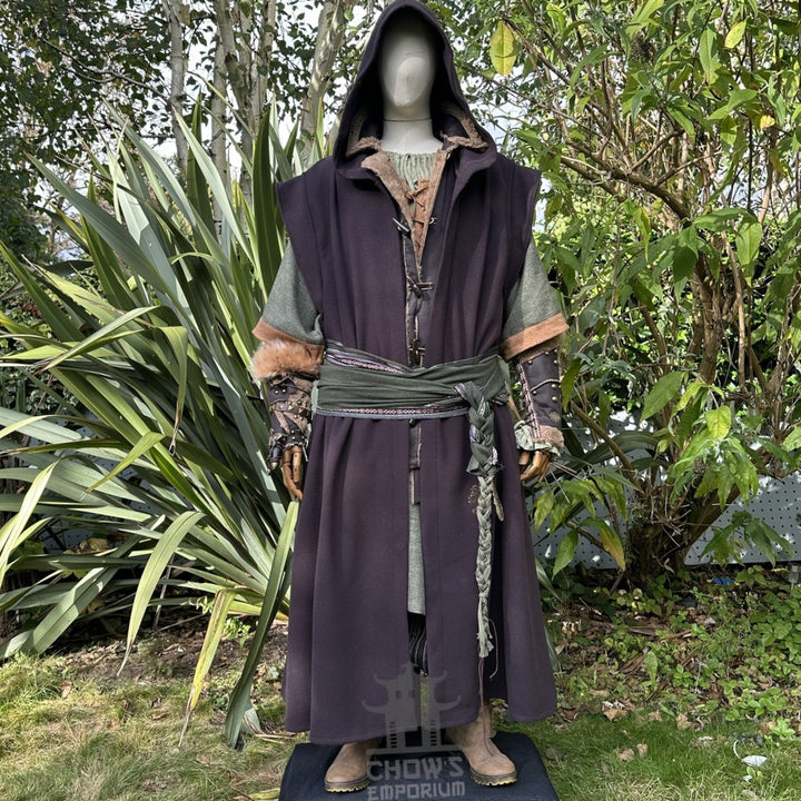 Medieval LARP outfit front view, featuring a brown hooded robe, waistcoat, vambraces, shirt, pants, belt, and 2 sashes. For Renaissance Faire and historical roleplay events.