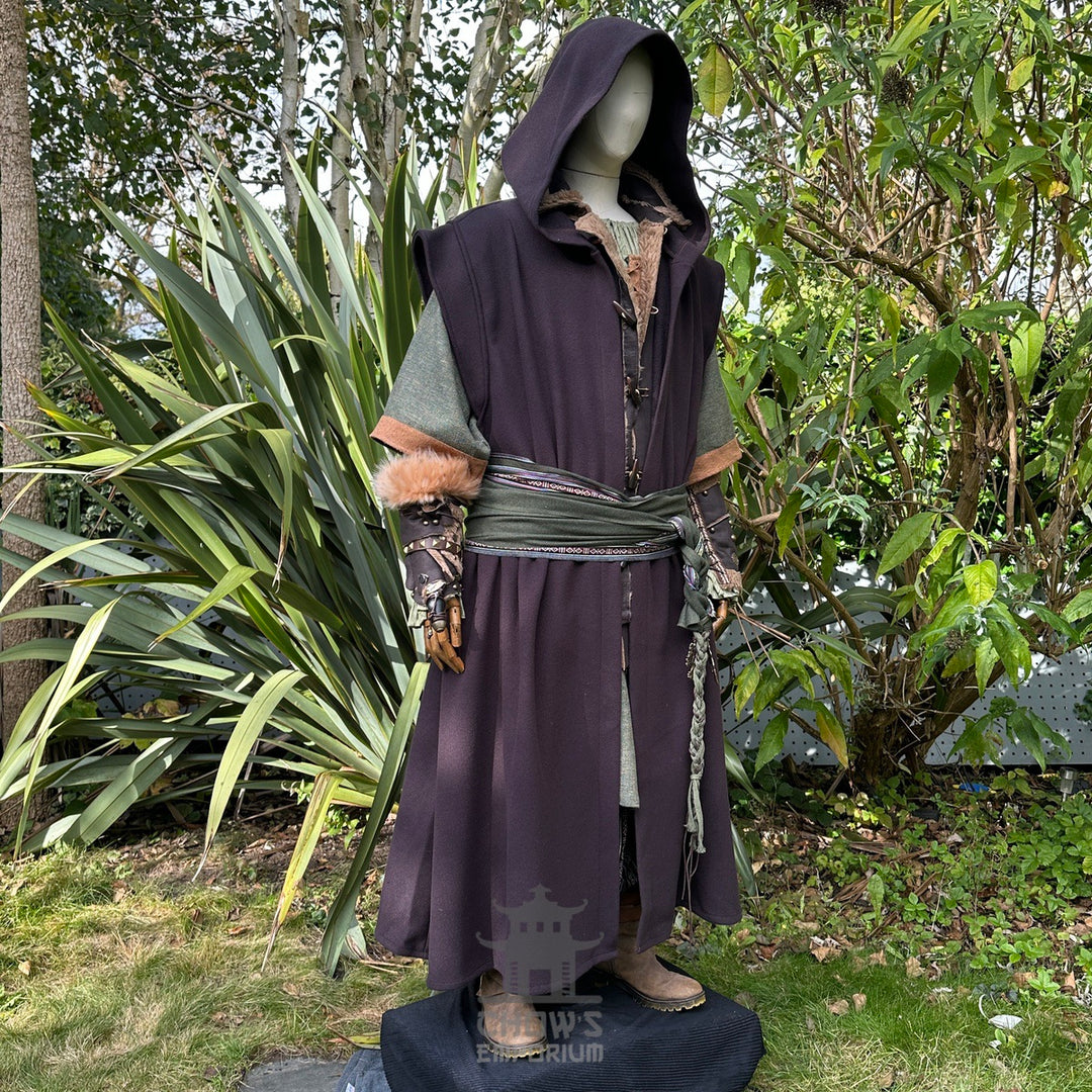 Medieval LARP outfit side view, featuring a brown hooded robe, waistcoat, vambraces, shirt, pants, belt, and 2 sashes. For Renaissance Faire and historical roleplay events.