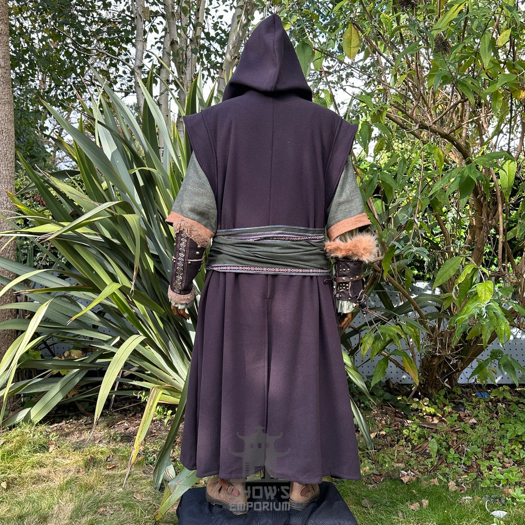 Medieval LARP outfit back view, featuring a brown hooded robe, waistcoat, vambraces, shirt, pants, belt, and 2 sashes. For Renaissance Faire and historical roleplay events.
