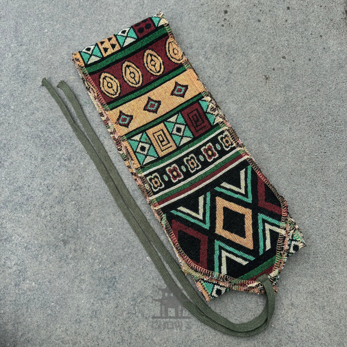 Multicoloured patterned sash with tribal design, perfect for medieval LARP outfits.