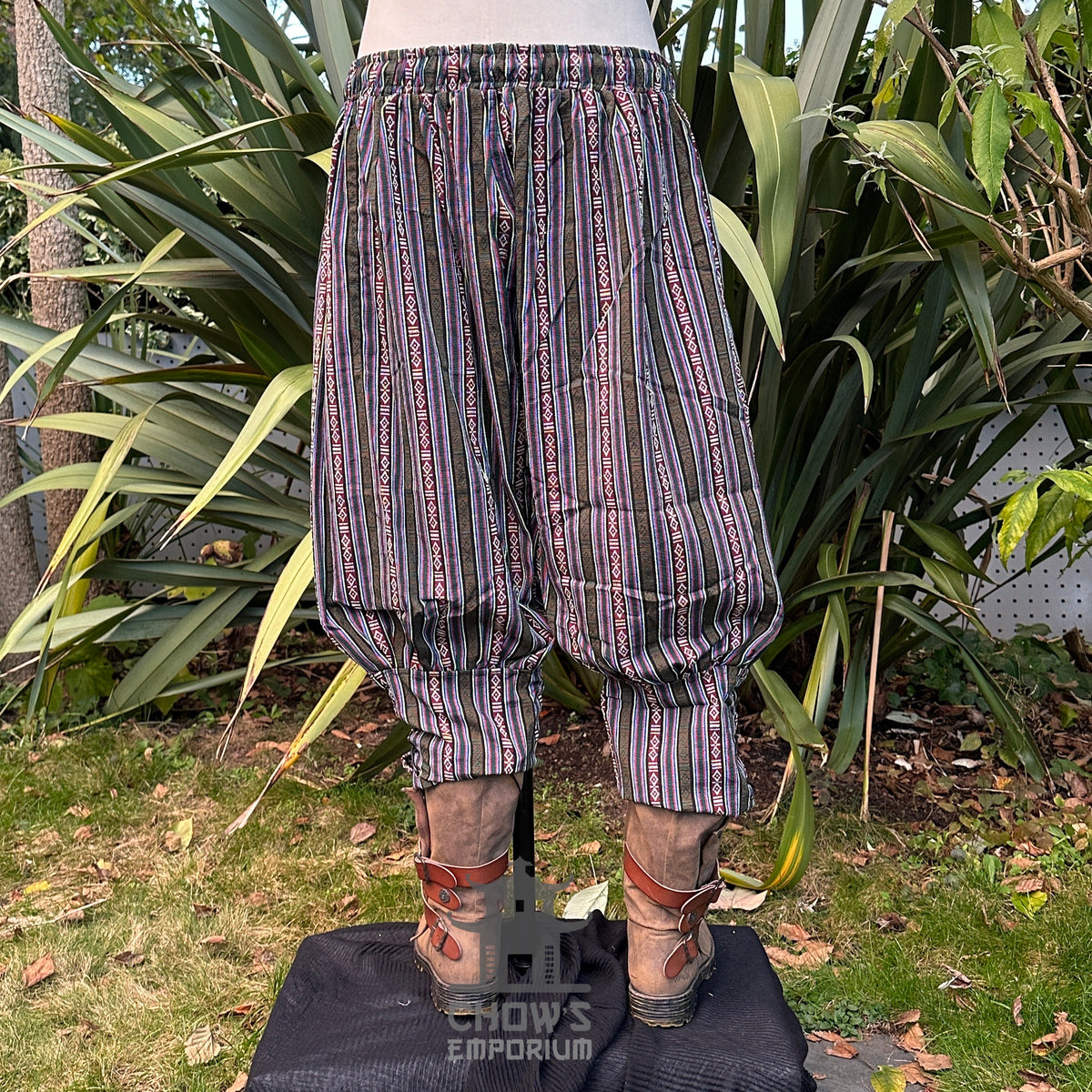 Front view of striped LARP Viking pants with boots.