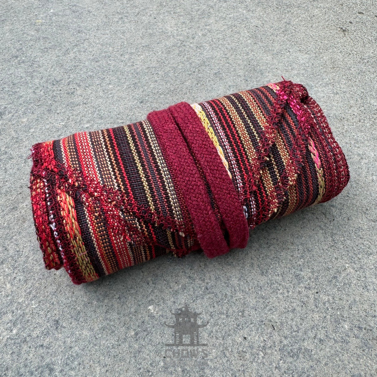 Autumnal stripe pirate sash, folded view, red and black.