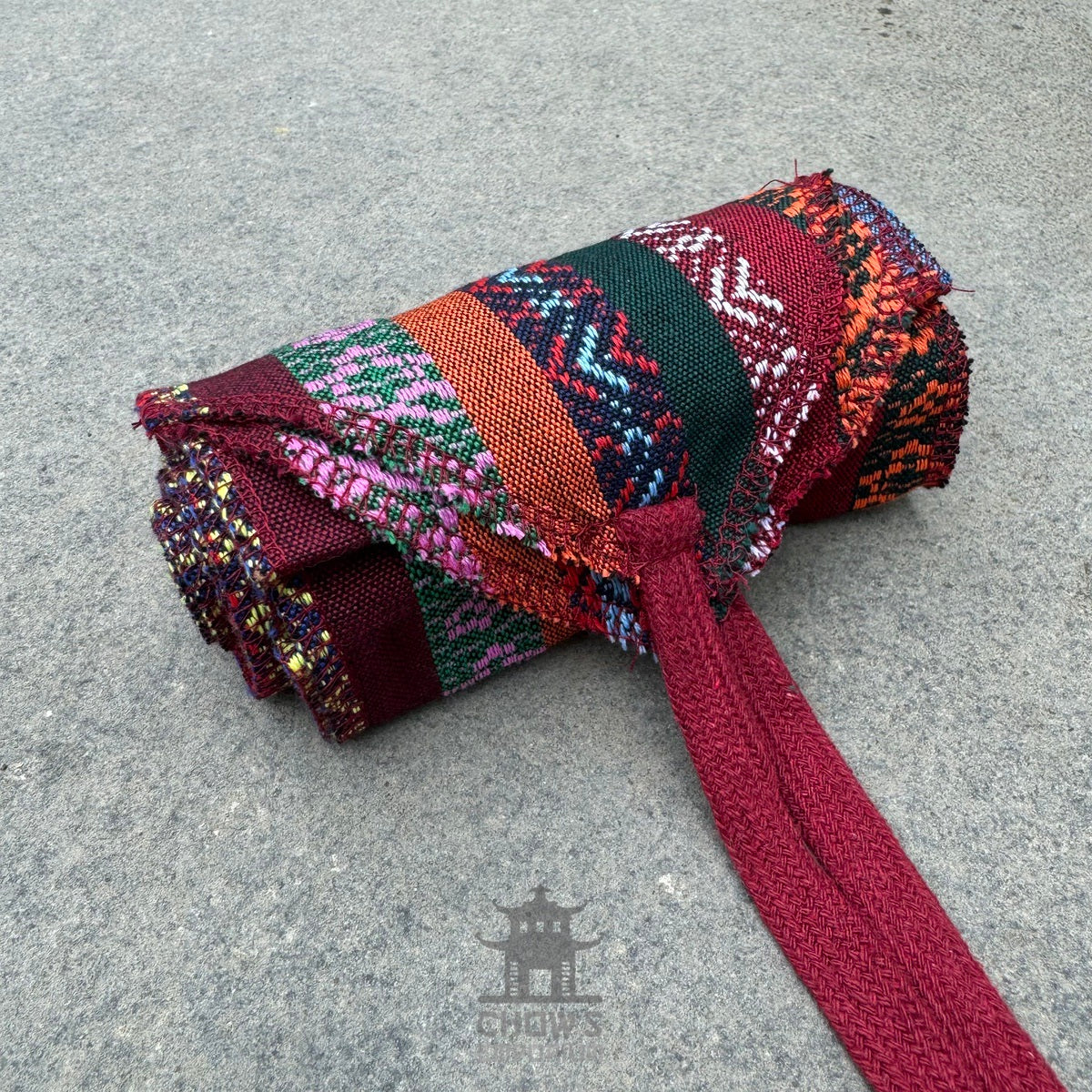 Multi stripe, woven pirate sash rolled up for LARP.