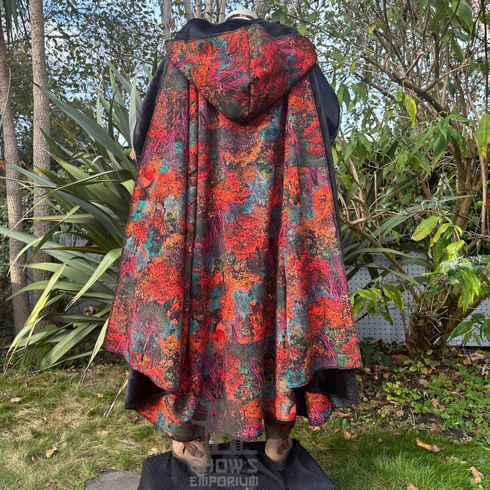 Medieval LARP outfit back view, featuring a hooded cloak, tunic, under tunic, trousers, and sash. For Renaissance Faire and historical roleplay events.