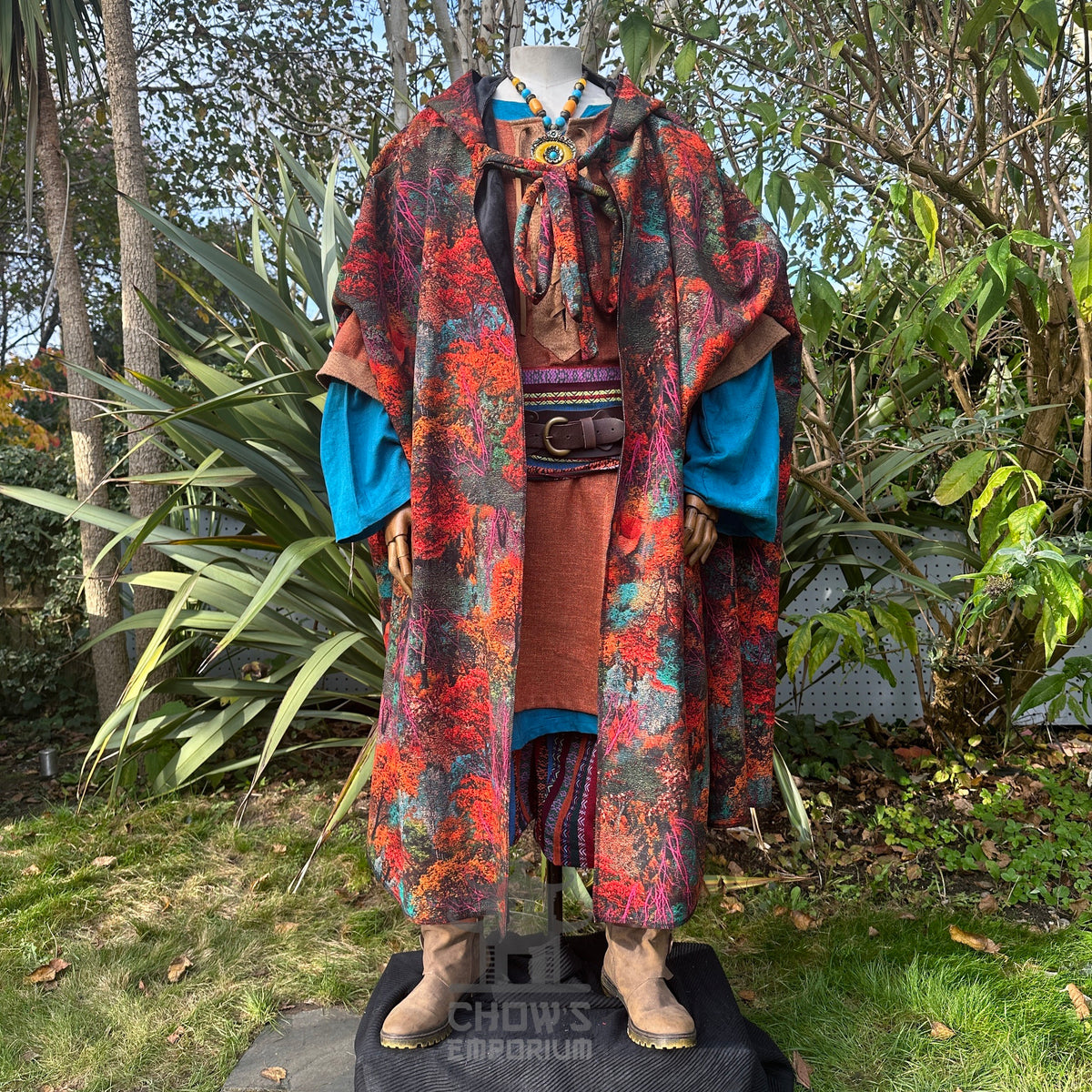 Front view with arms out of Autumn Druid Cloak with autumn leaf pattern, fur lining, and.