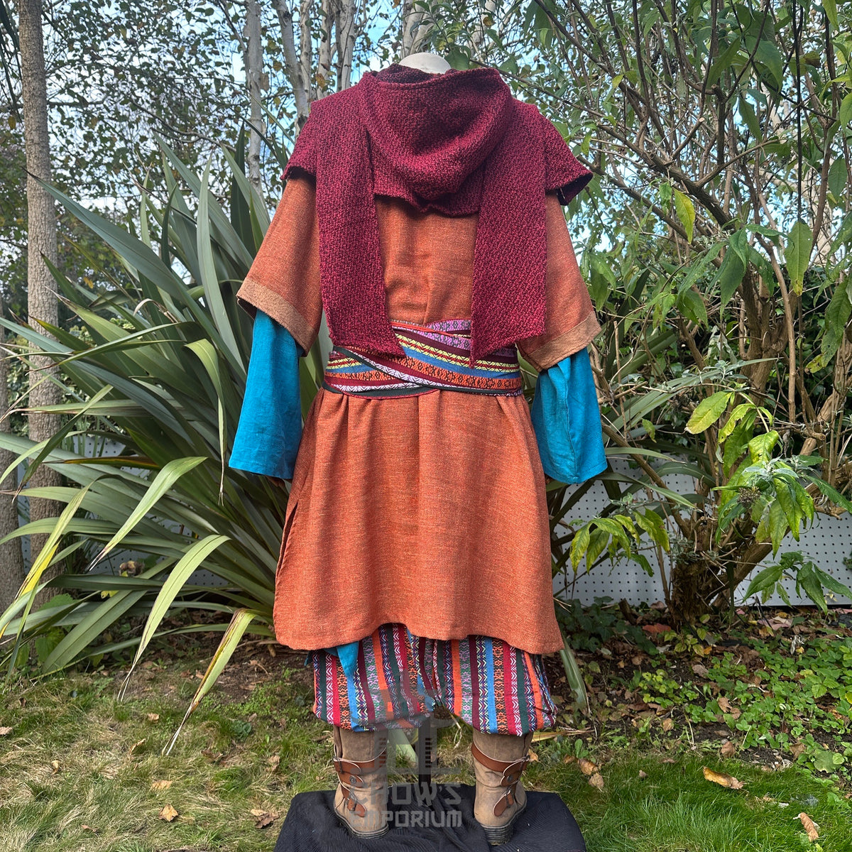 Medieval LARP pedlar set with hood, tunics, trousers, and sash, rear view.
